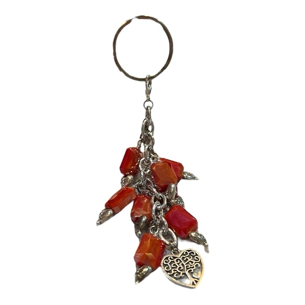 Hand made silver-tone keychain. Iridescent orange/red tone with heart.